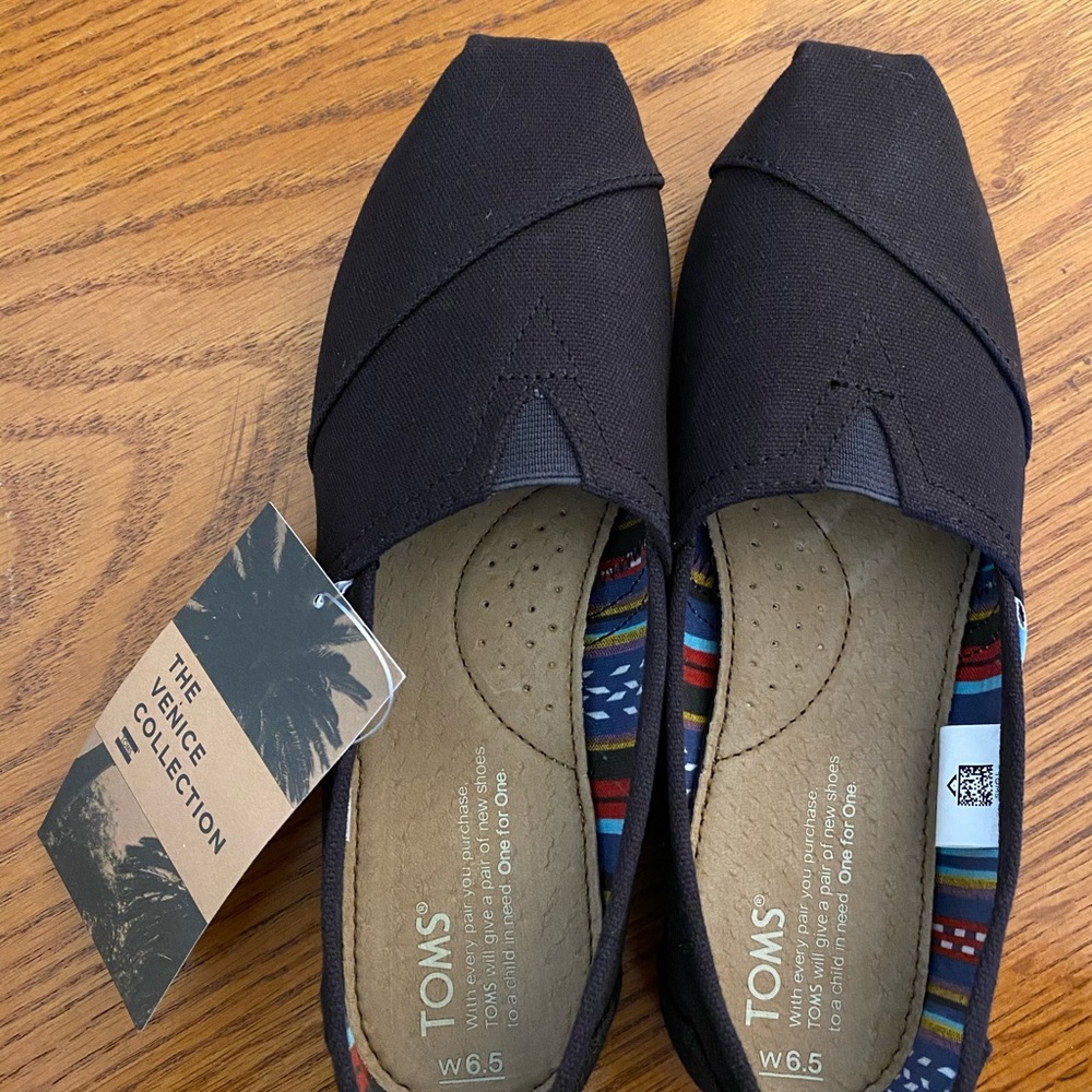 TOMS Black Canvas Slip-ons